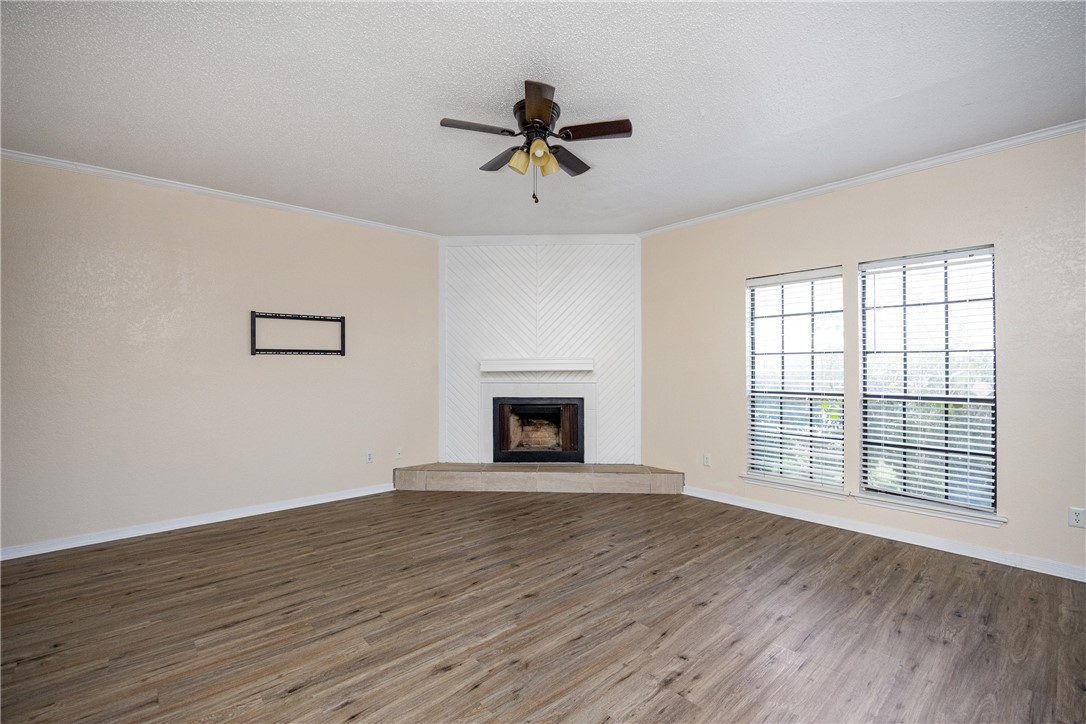 3052 Quail Springs Road, Unit A2 Corpus Christi, TX 78414 - Photo 8 of 31 wooden floor in an empty room with a window