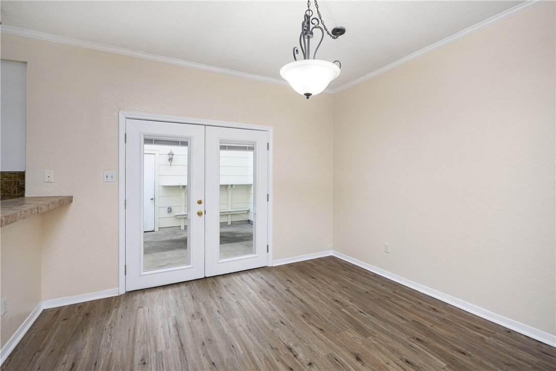 3052 Quail Springs Road, Unit A2 Corpus Christi, TX 78414 - Photo 9 of 31 a view of empty room with wooden floor