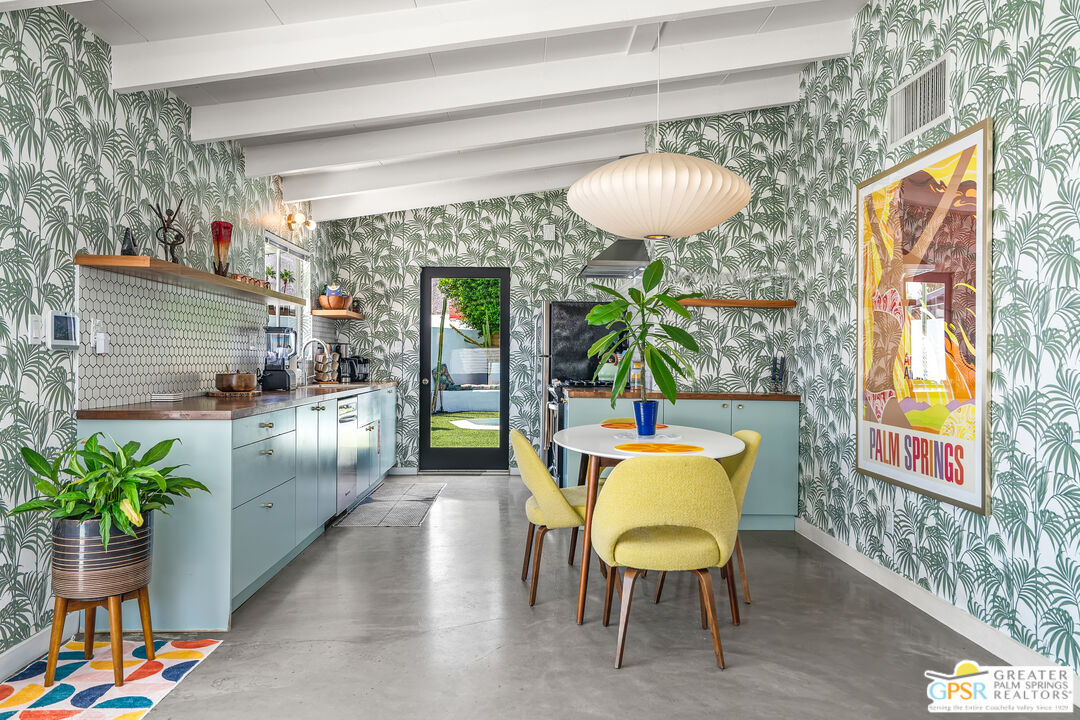 1655 Tamarisk Road Palm Springs, CA 92262 - Photo 15 of 39 a view of a dining room with furniture and a potted plant