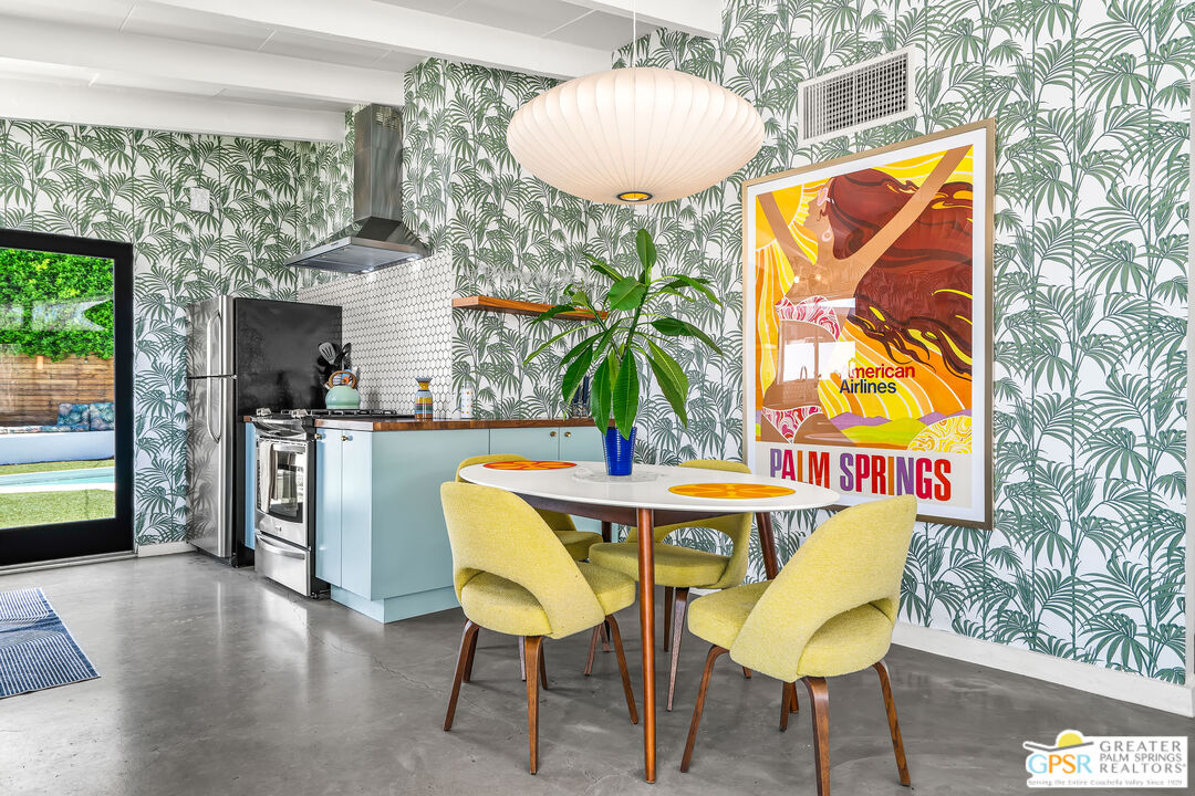 1655 Tamarisk Road Palm Springs, CA 92262 - Photo 16 of 39 a view of a room with furniture and wooden floor