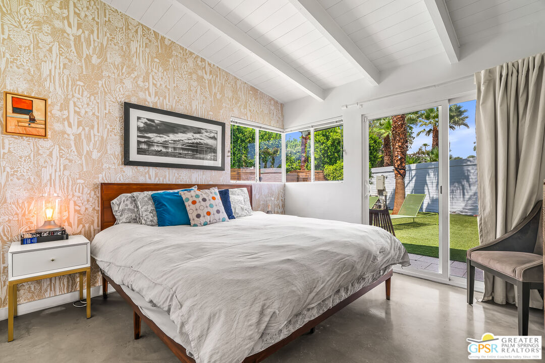 1655 Tamarisk Road Palm Springs, CA 92262 - Photo 25 of 39 a bedroom with a bed painting and a large window