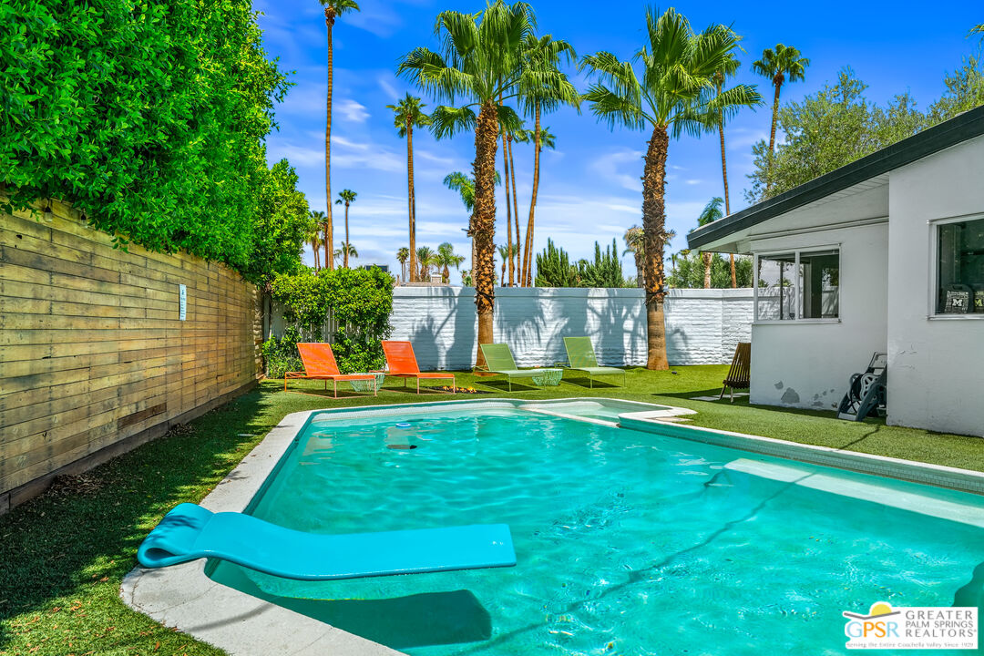 1655 Tamarisk Road Palm Springs, CA 92262 - Photo 29 of 39 a view of a backyard with swimming pool