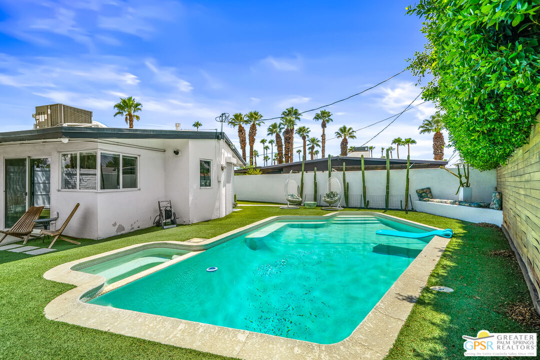 1655 Tamarisk Road Palm Springs, CA 92262 - Photo 31 of 39 a view of a house with a yard porch and sitting area