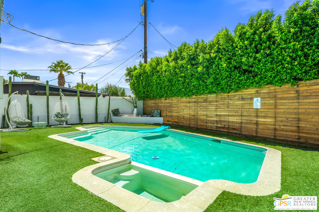 1655 Tamarisk Road Palm Springs, CA 92262 - Photo 32 of 39 a view of a backyard with plants and a patio
