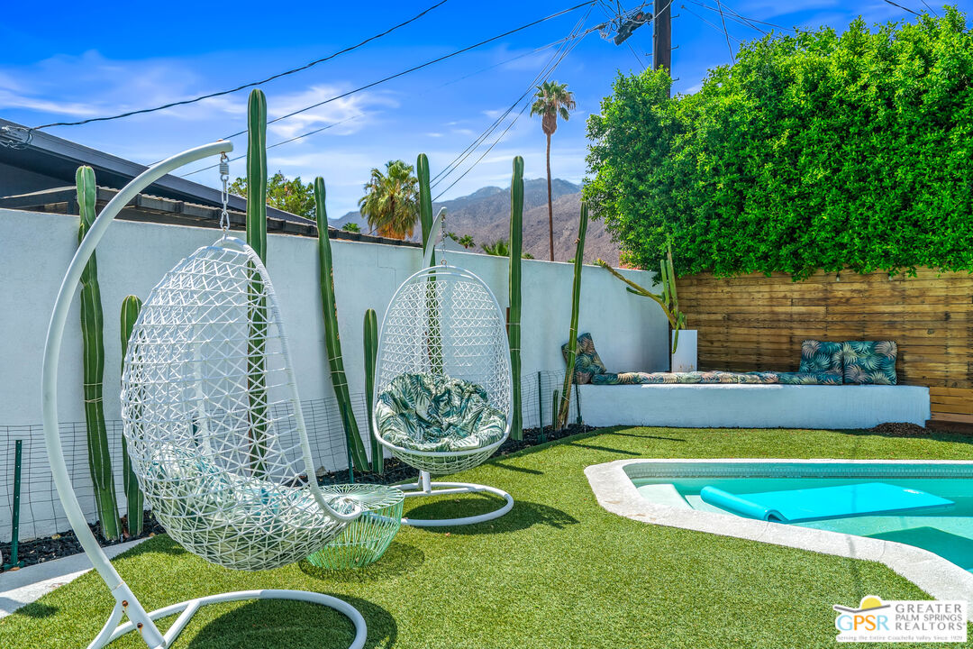 1655 Tamarisk Road Palm Springs, CA 92262 - Photo 33 of 39 a view of a swimming pool with a patio