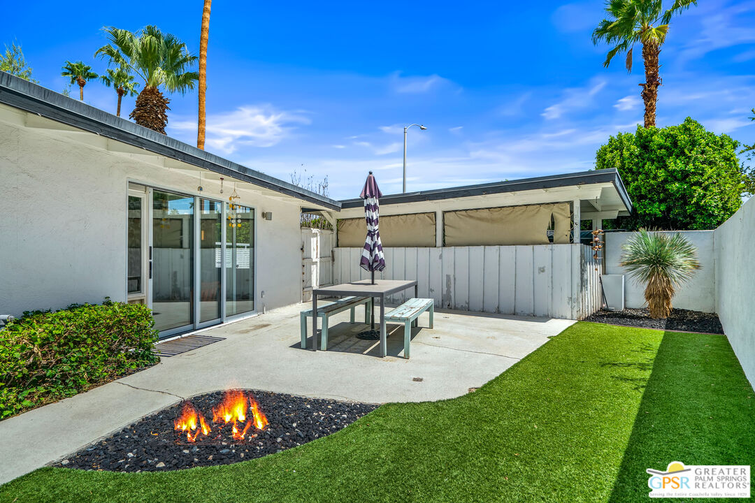 1655 Tamarisk Road Palm Springs, CA 92262 - Photo 35 of 39 a view of a backyard with a garden and patio