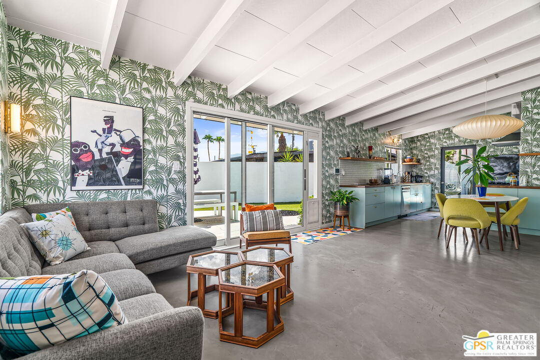 1655 Tamarisk Road Palm Springs, CA 92262 - Photo 7 of 39 a living room with furniture and a floor to ceiling window