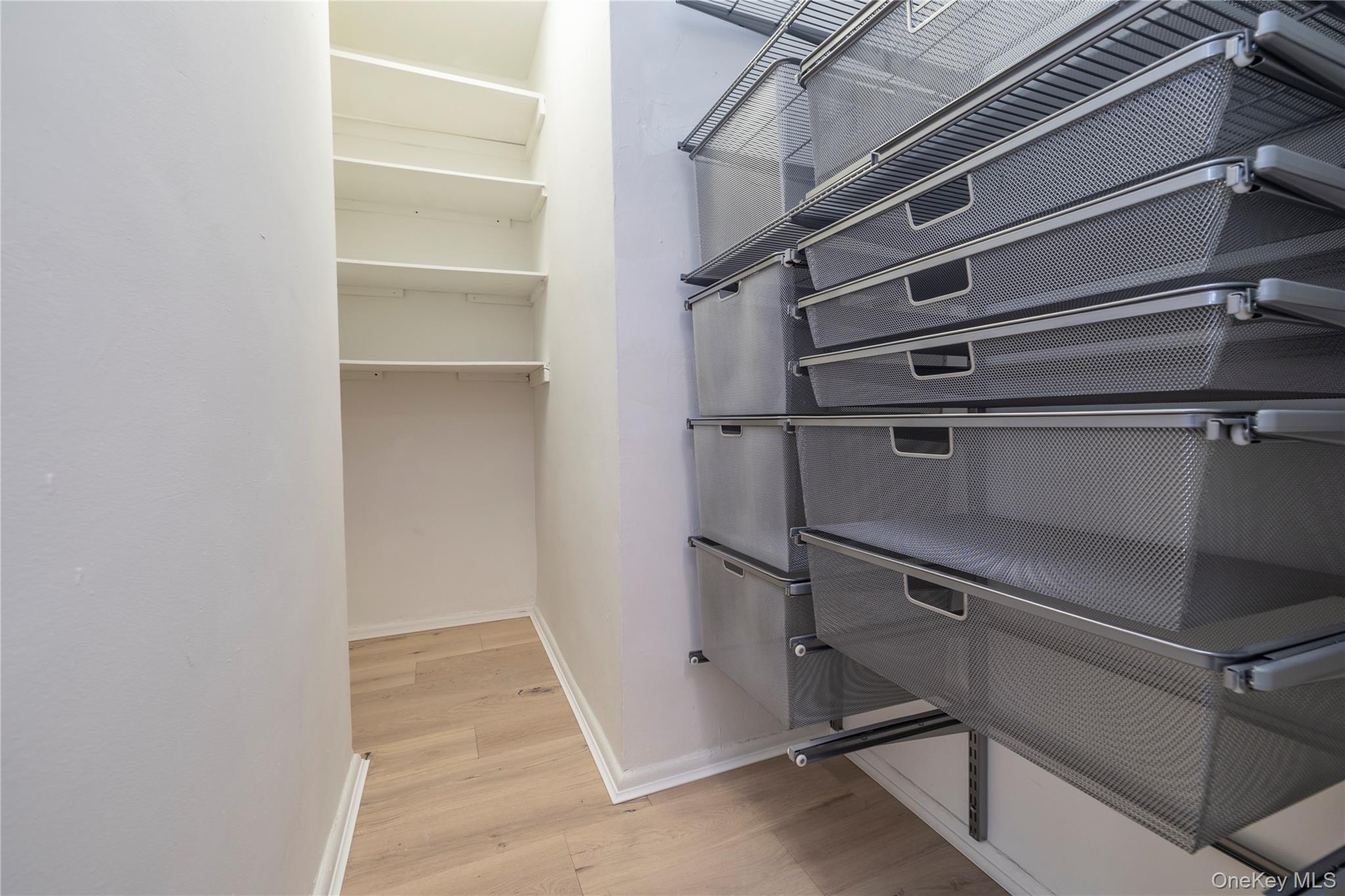666 Shore Road, Unit 6M Long Beach, NY 11561 - Photo 15 of 24 a view of walk in closet with empty racks