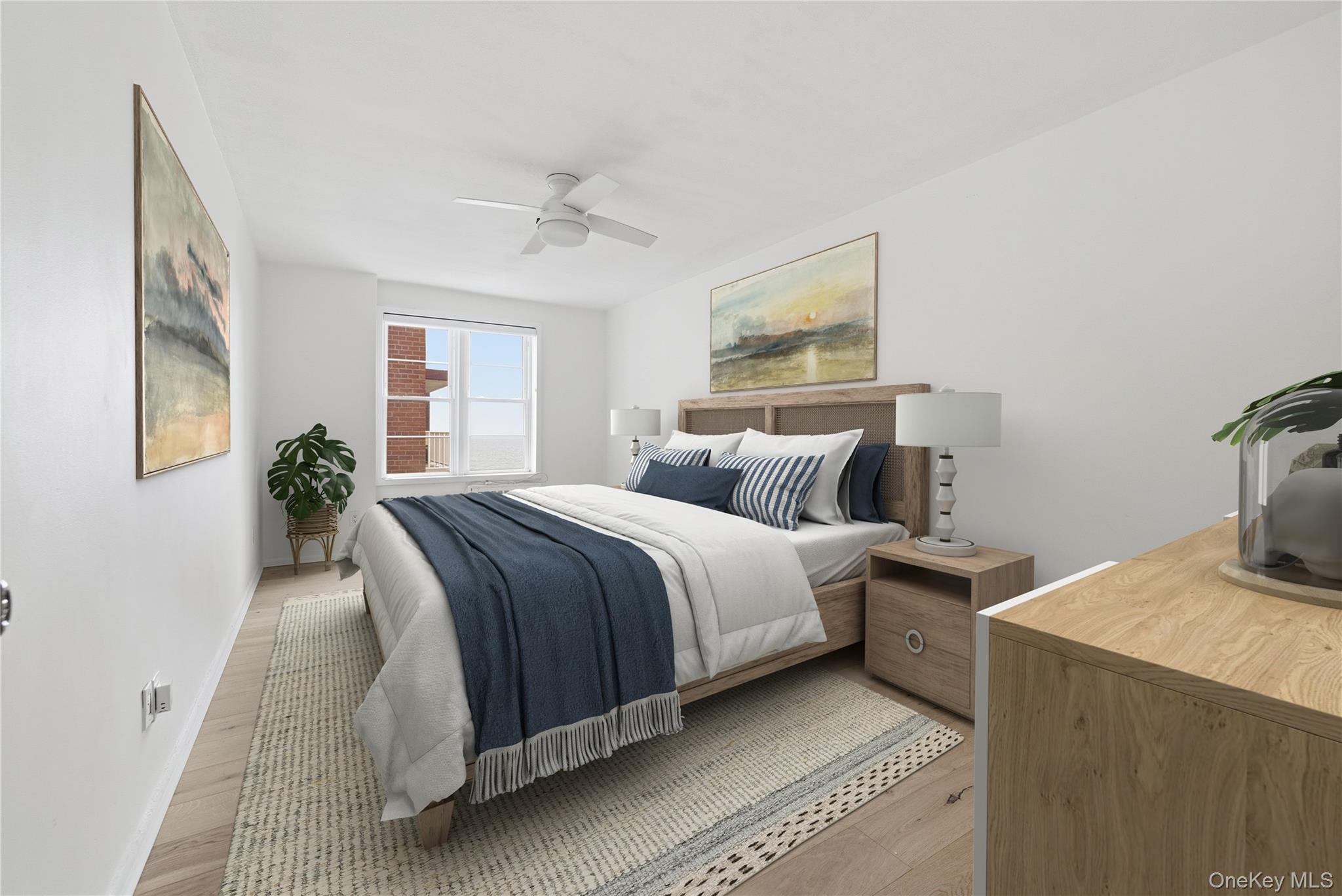 666 Shore Road, Unit 6M Long Beach, NY 11561 - Photo 17 of 24 a bedroom with a bed and wooden floor