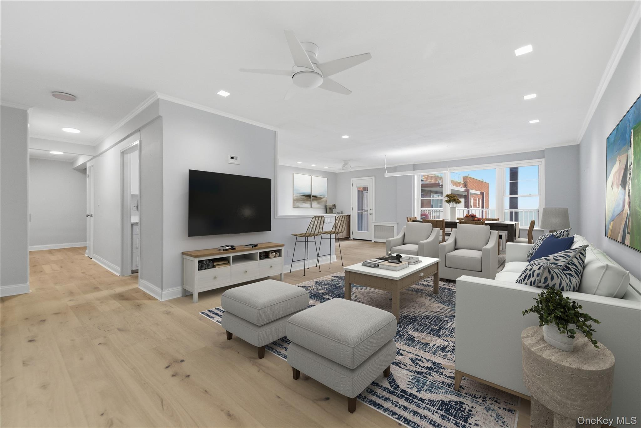 666 Shore Road, Unit 6M Long Beach, NY 11561 - Photo 2 of 24 a living room with furniture and a flat screen tv