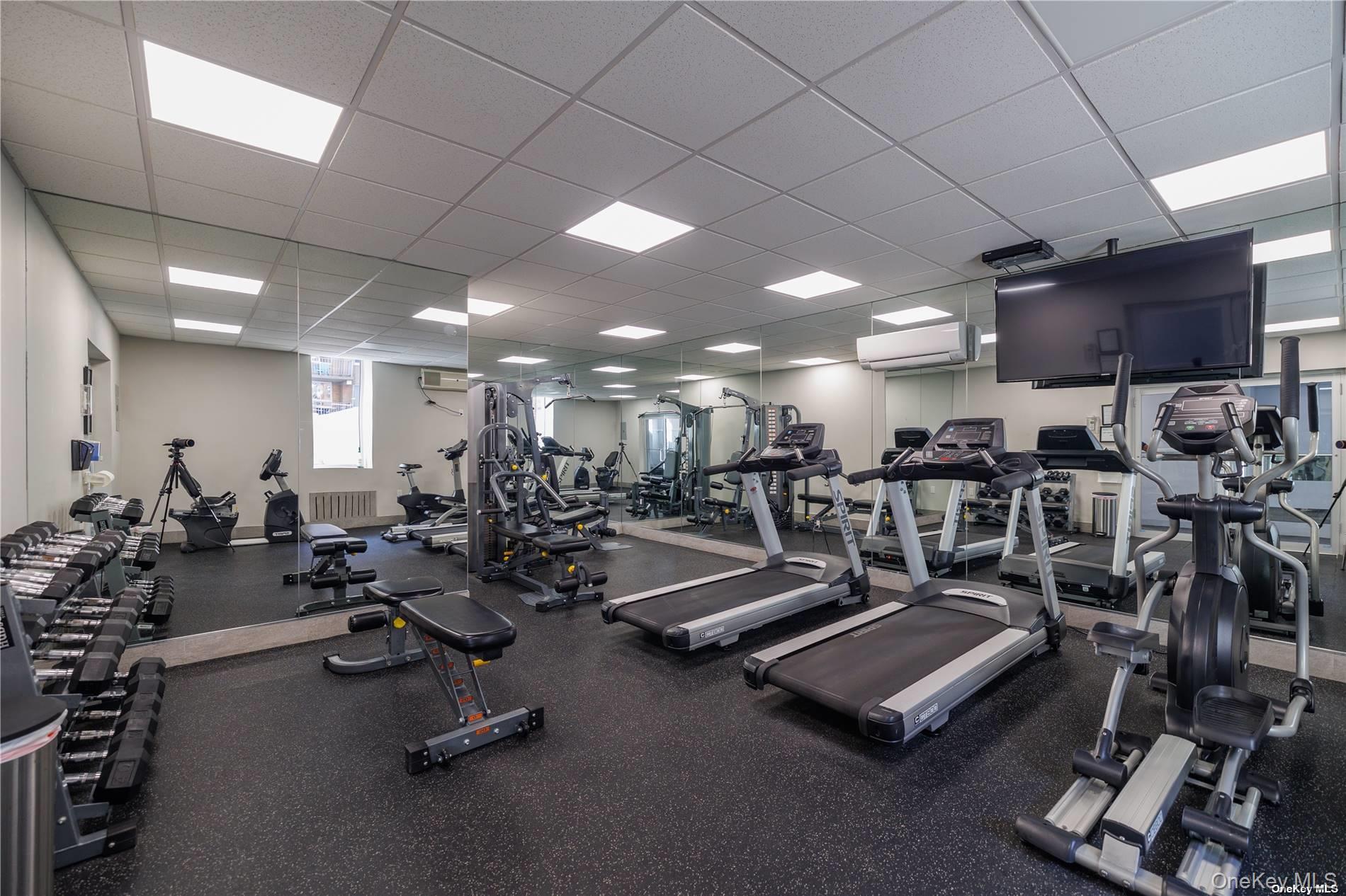 666 Shore Road, Unit 6M Long Beach, NY 11561 - Photo 21 of 24 a view of a room with gym equipment