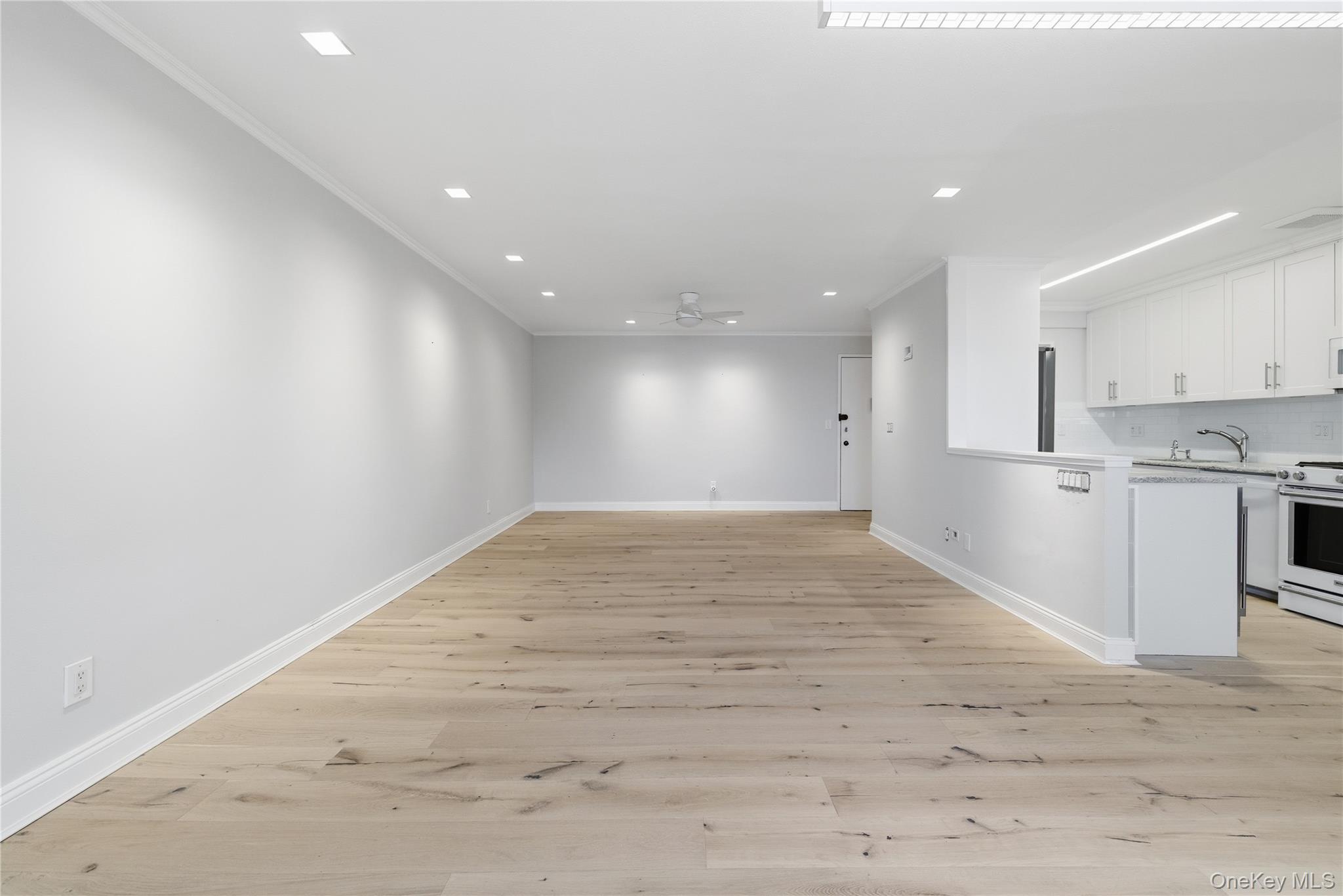 666 Shore Road, Unit 6M Long Beach, NY 11561 - Photo 9 of 24 a view of empty room with wooden floor