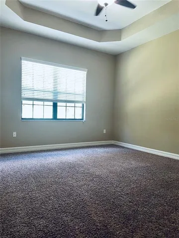 an empty room with a empty space and windows