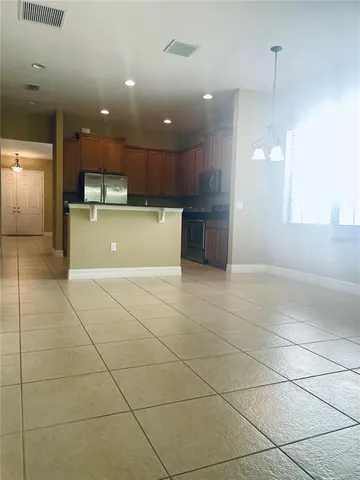 a view of a kitchen with a sink and cabinets