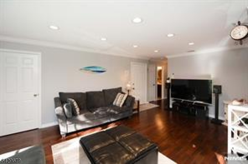 11A South Maple Avenue, Unit B Park Ridge, NJ 07656 - Photo 13 of 16 a living room with furniture and a flat screen tv