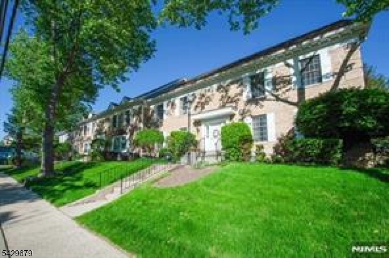 11A South Maple Avenue, Unit B Park Ridge, NJ 07656 - Photo 2 of 16 a view of a building with a yard