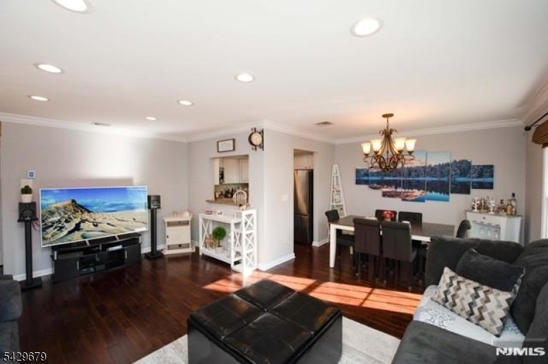 11A South Maple Avenue, Unit B Park Ridge, NJ 07656 - Photo 3 of 16 a living room with furniture and a wooden floor
