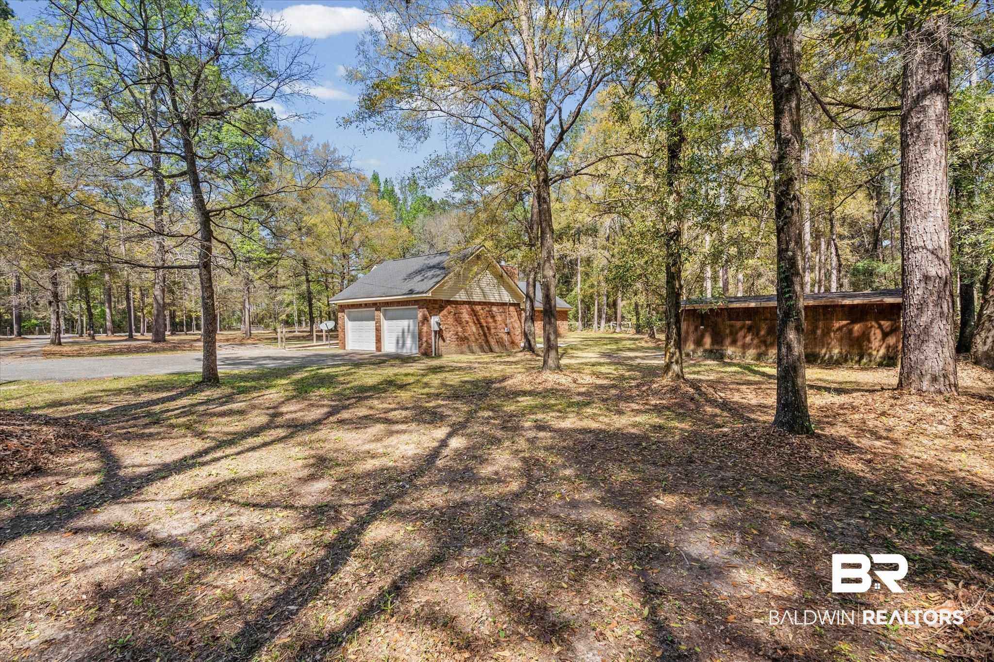9770 Lakeview Road Bay Minette, AL 36507 - Photo 30 of 44 Back Yard Area & Attached Garage