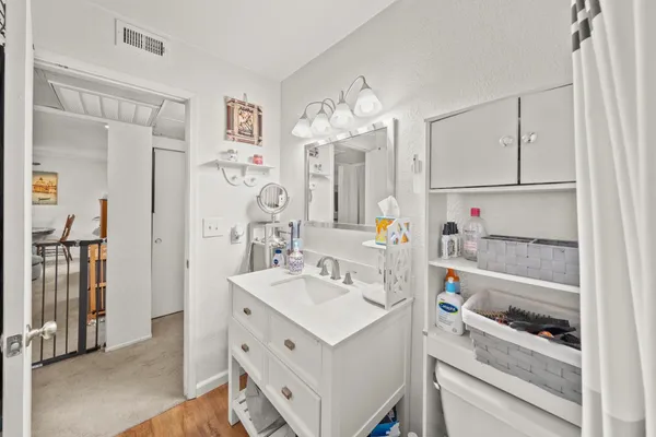 a bathroom with a sink a vanity and a mirror