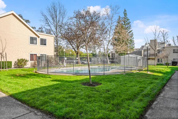 a view of a garden with a house