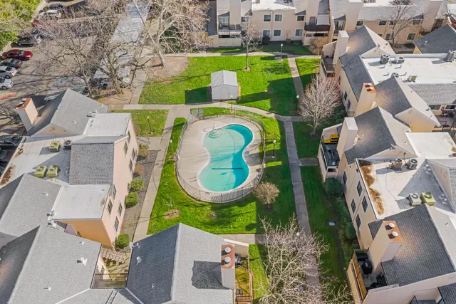 an aerial view of a house with a swimming pool