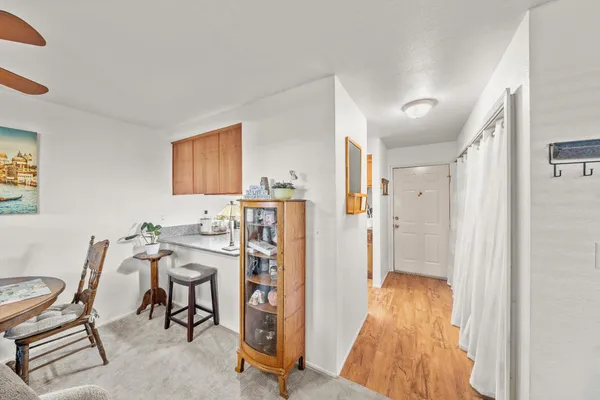 a view of a livingroom with furniture and a window