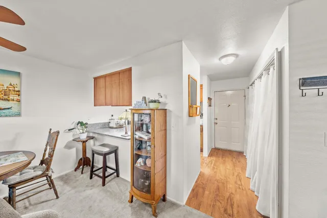 a view of a livingroom with furniture and a window