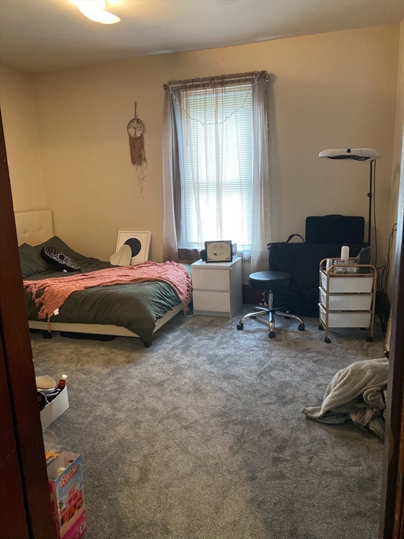 877 High Street Fall River, MA 02720 - Photo 11 of 26 a bedroom with a bed and a couch