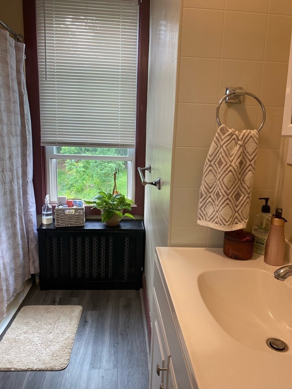 877 High Street Fall River, MA 02720 - Photo 13 of 26 a bathroom with a bathtub and shower