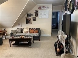 877 High Street Fall River, MA 02720 - Photo 19 of 26 a bedroom with furniture and a chandelier