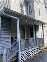 877 High Street Fall River, MA 02720 - Photo 4 of 26 a side view of a house with a window