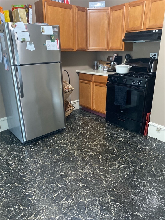 877 High Street Fall River, MA 02720 - Photo 6 of 26 a kitchen with stainless steel appliances granite countertop a refrigerator a stove a sink and a refrigerator