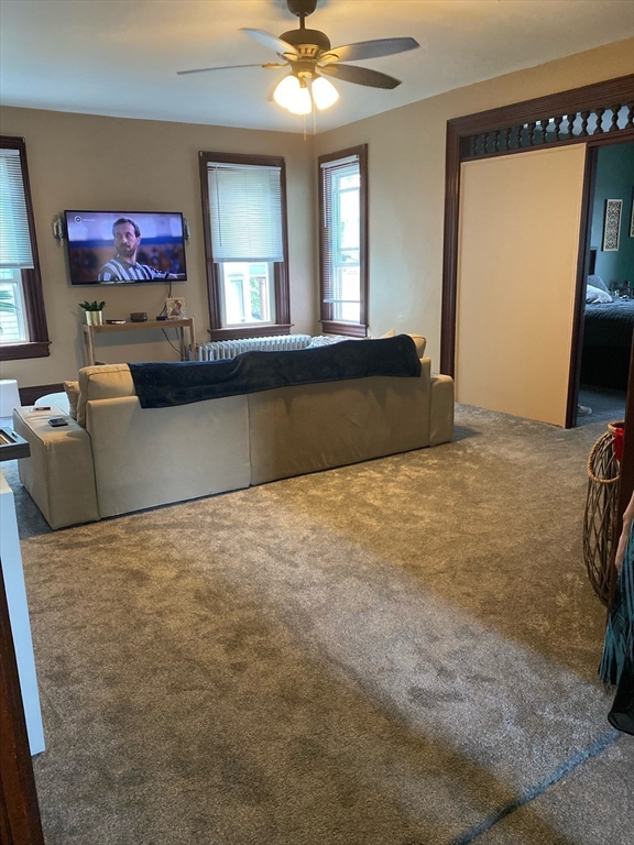 877 High Street Fall River, MA 02720 - Photo 8 of 26 a bed room with a bed and a television