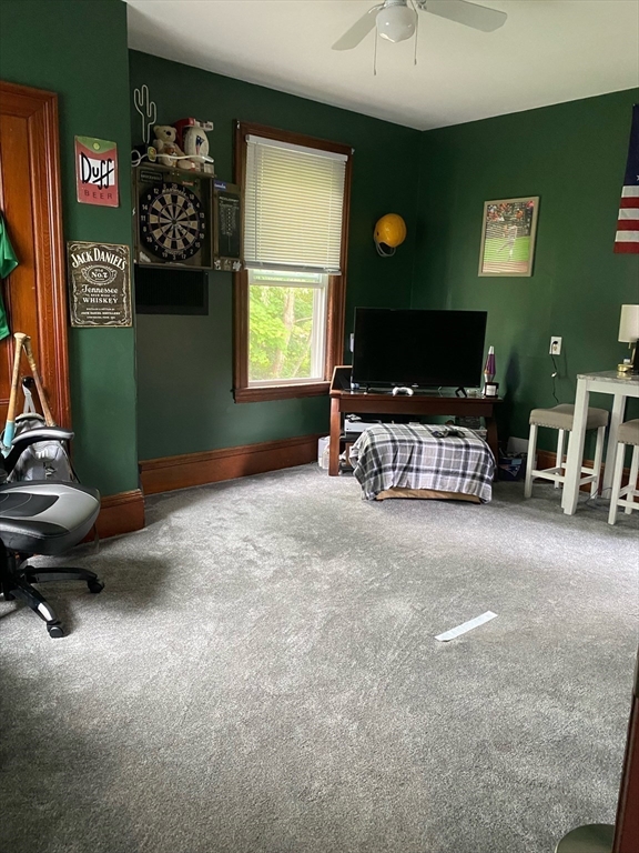 877 High Street Fall River, MA 02720 - Photo 10 of 26 a living room with furniture and a flat screen tv
