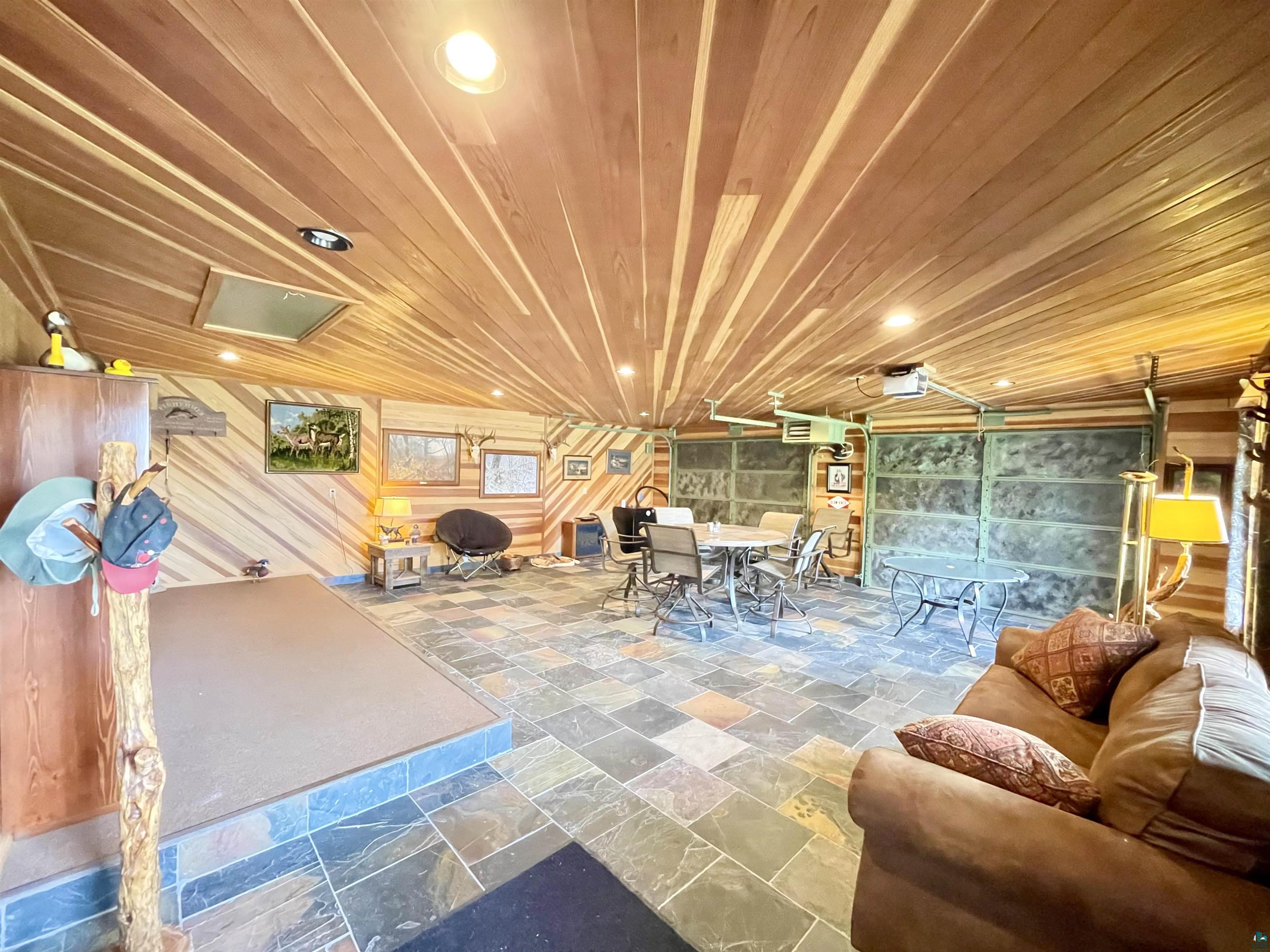 183 Cramer Road Schroeder, MN 55613 - Photo 33 of 50 T & G cedar. Slate floors. Screened overhead doors.