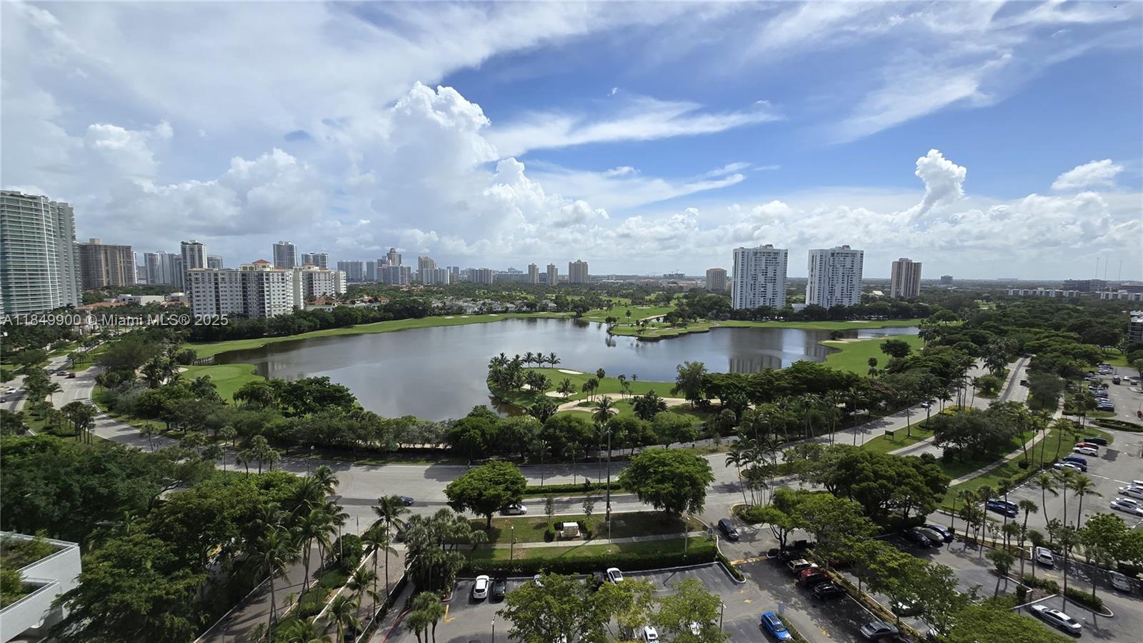 3731 North Country Club Drive, Unit 1825 Aventura, FL 33180 - Photo 12 of 25 a view of a lake with a city