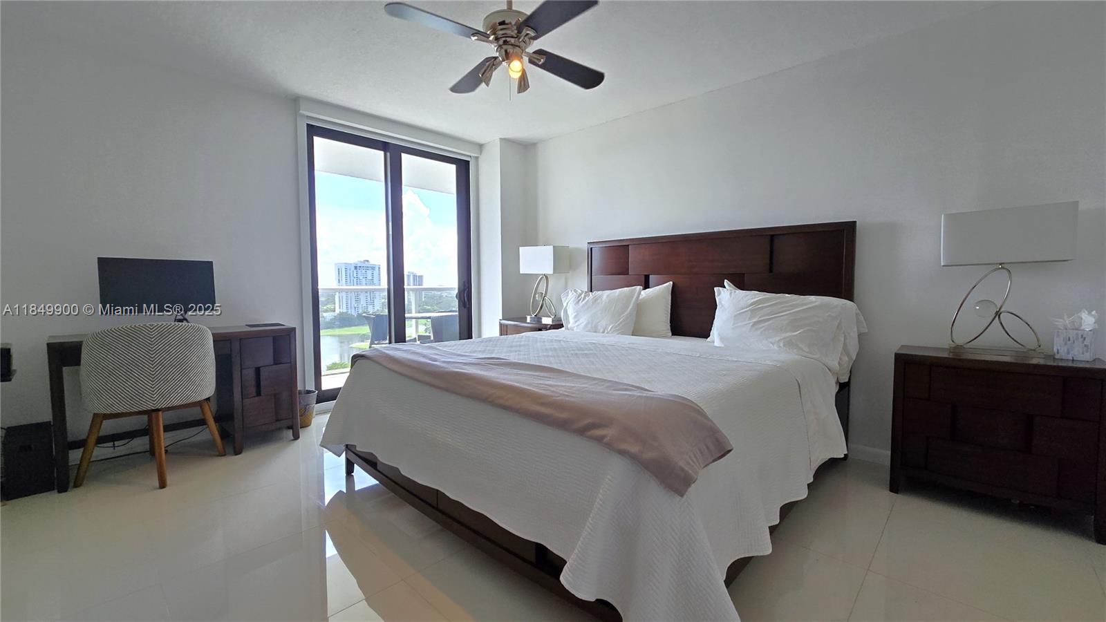 3731 North Country Club Drive, Unit 1825 Aventura, FL 33180 - Photo 13 of 25 a bedroom with a bed and a window