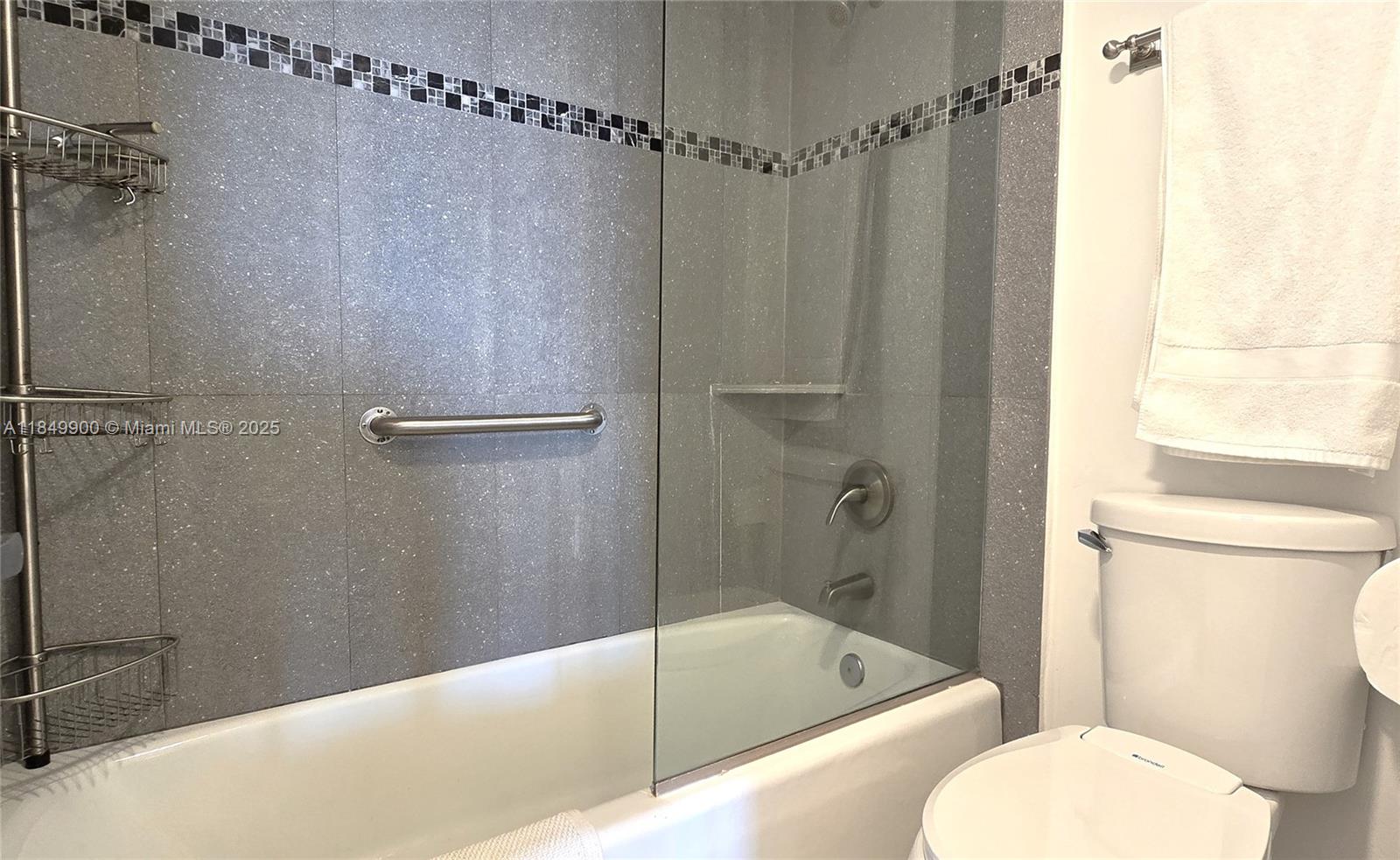 3731 North Country Club Drive, Unit 1825 Aventura, FL 33180 - Photo 18 of 25 a bathroom with a toilet and shower