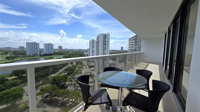 a balcony view with couple of chairs