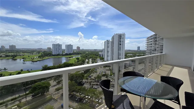 a view of balcony with outdoor seating and city view