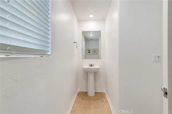 a view of a kitchen with granite countertop cabinets and stainless steel appliances