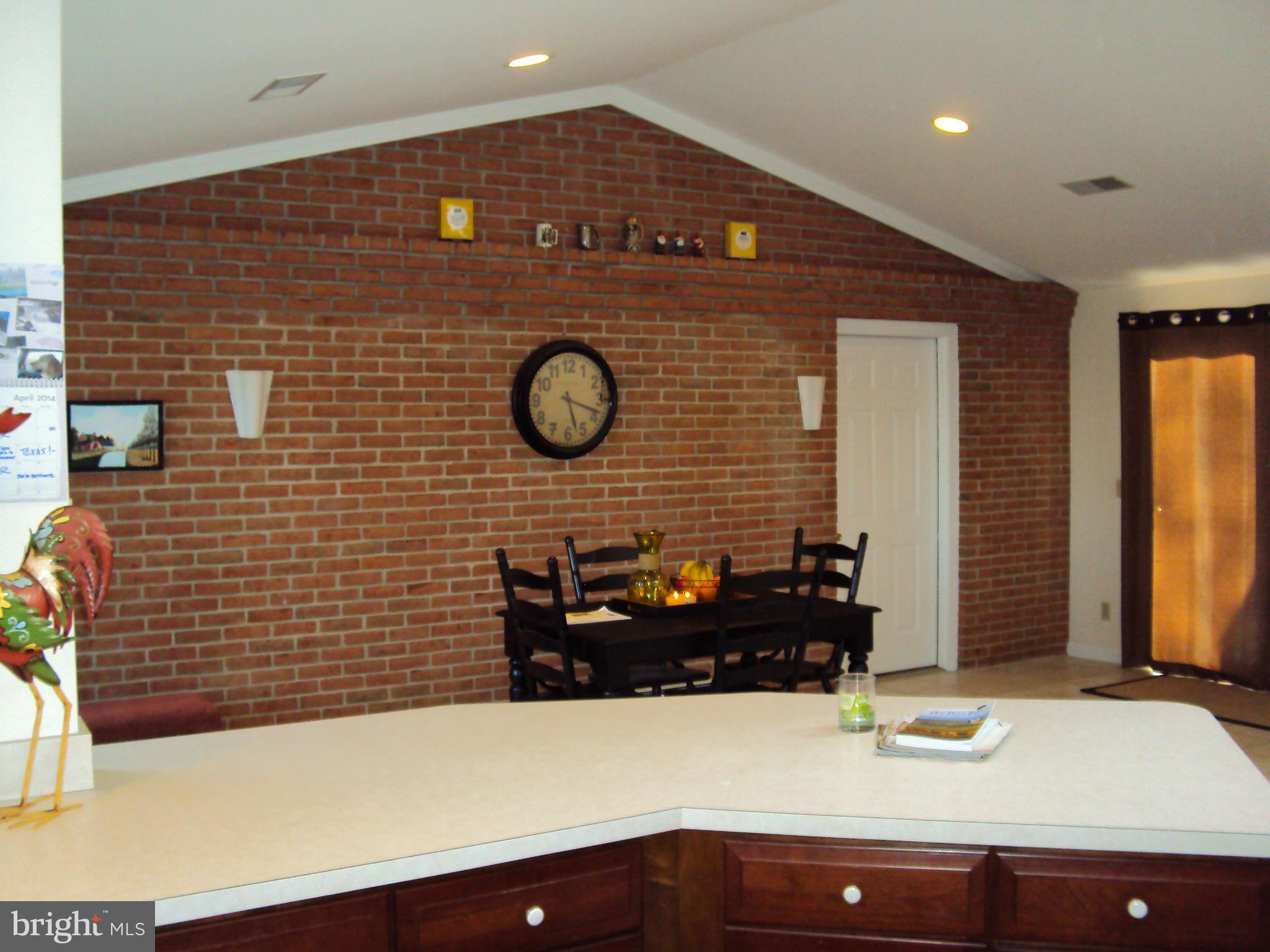 8337 Walter Martz Road Frederick, MD 21702 - Photo 14 of 30 Eating Area with Brick wall