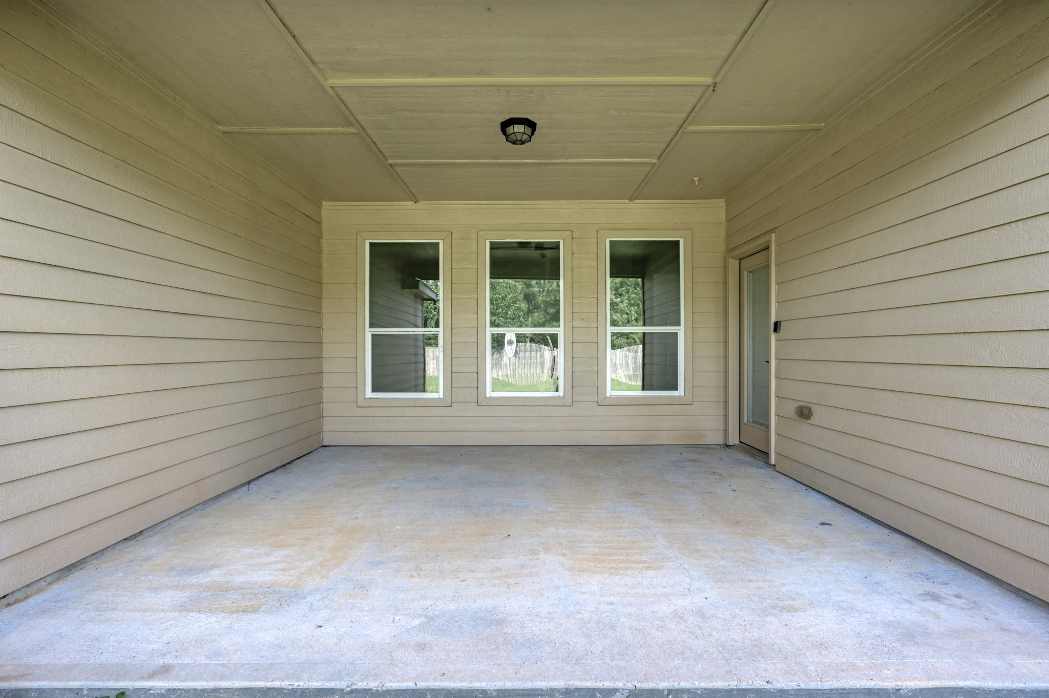 18894 Maverick Ranch Road West Magnolia, TX 77355 - Photo 33 of 43 View of the Covered Patio from the Back Yar.