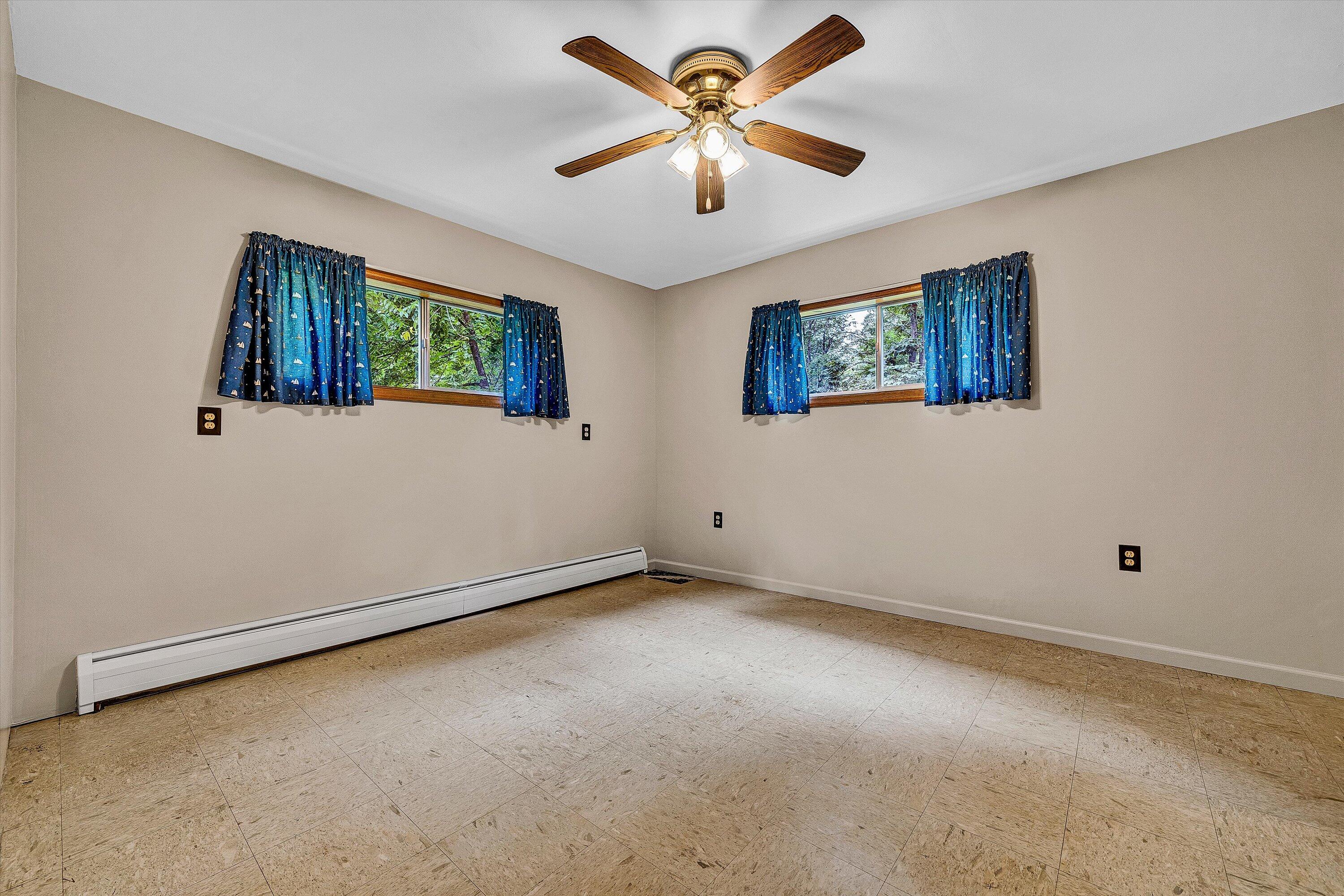 4463 Nemmo Road Vinton, VA 24179 - Photo 19 of 34 an empty room with windows and fan
