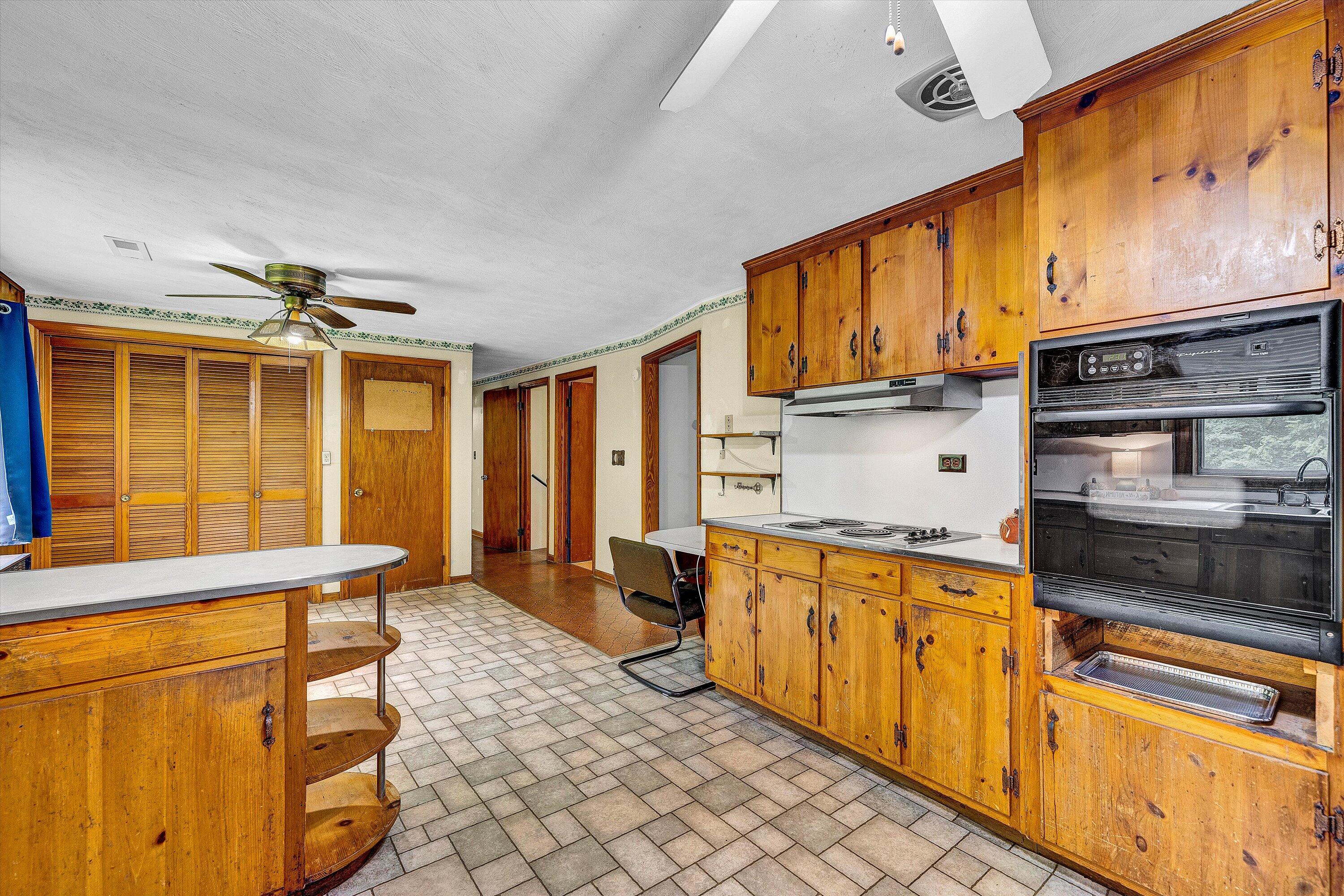 4463 Nemmo Road Vinton, VA 24179 - Photo 7 of 34 a kitchen with stainless steel appliances granite countertop a stove a sink and a microwave