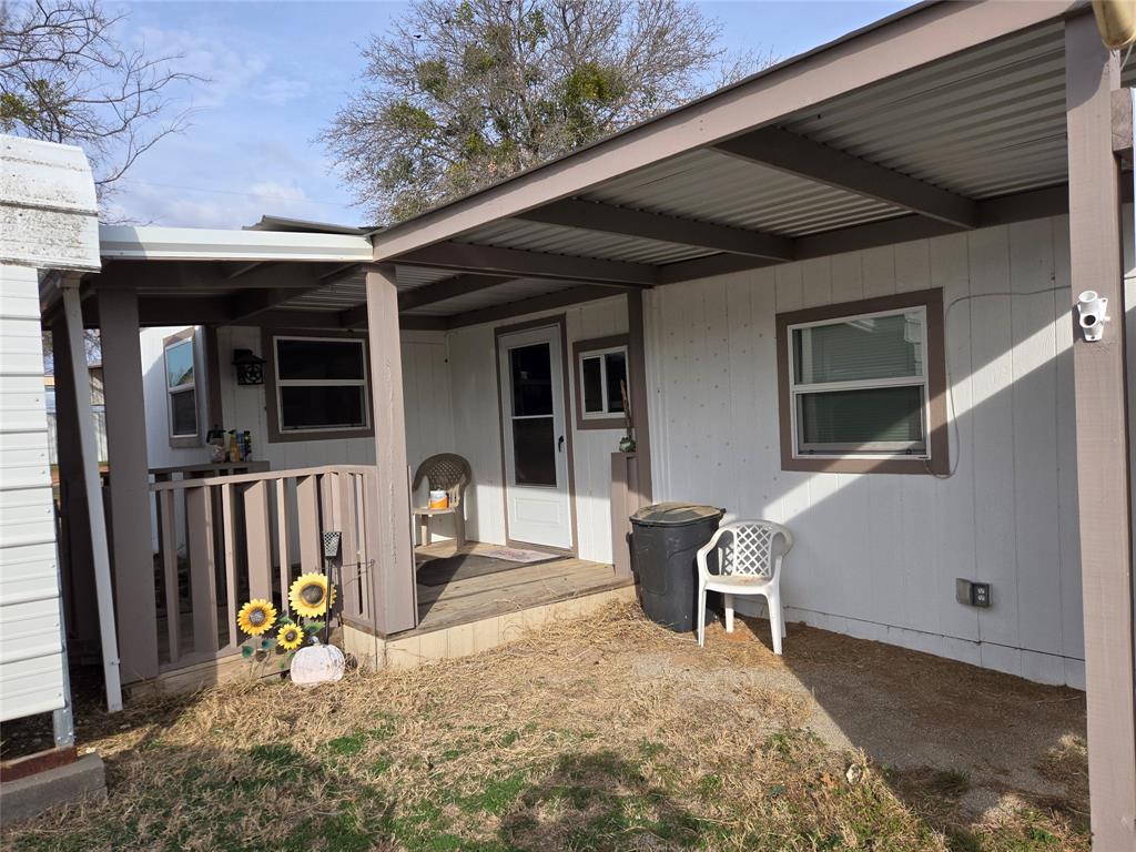 242 Treasure Beach Comanche, TX 76442 - Photo 1 of 22 a view of outdoor space with deck and furniture