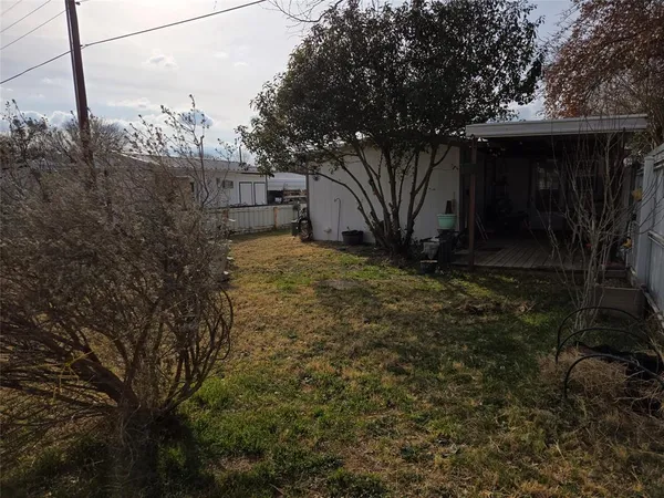 a view of a backyard of the house