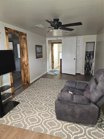 a living room with a couch and a dresser