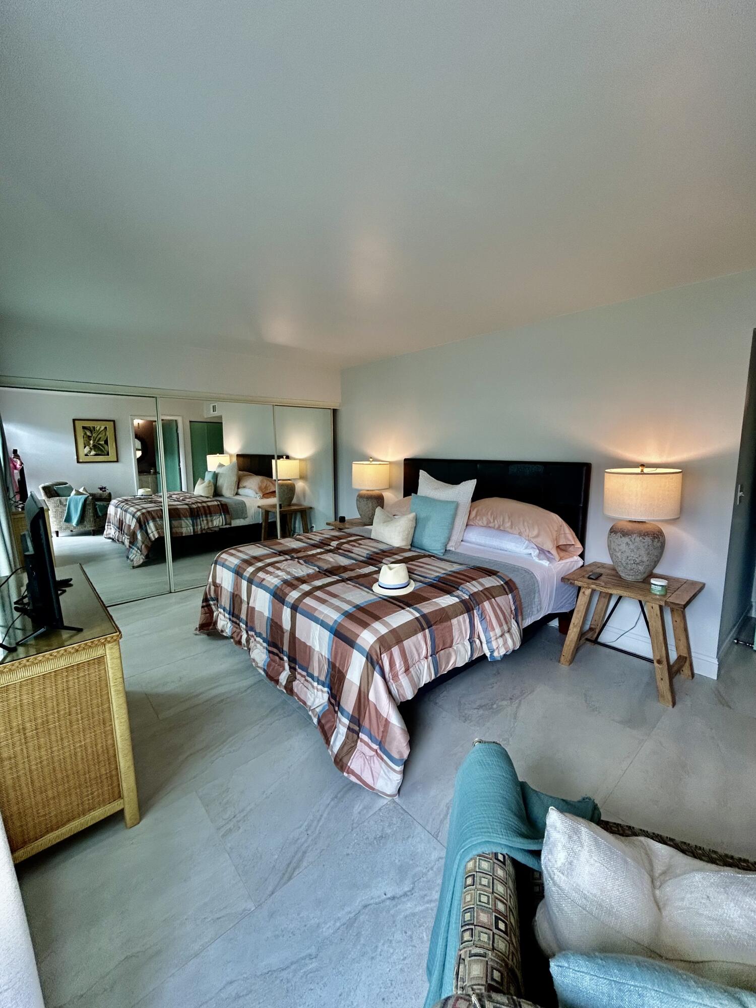 5289 Lake Front Boulevard, Unit D Delray Beach, FL 33484 - Photo 12 of 14 a bedroom with a bed and a couch