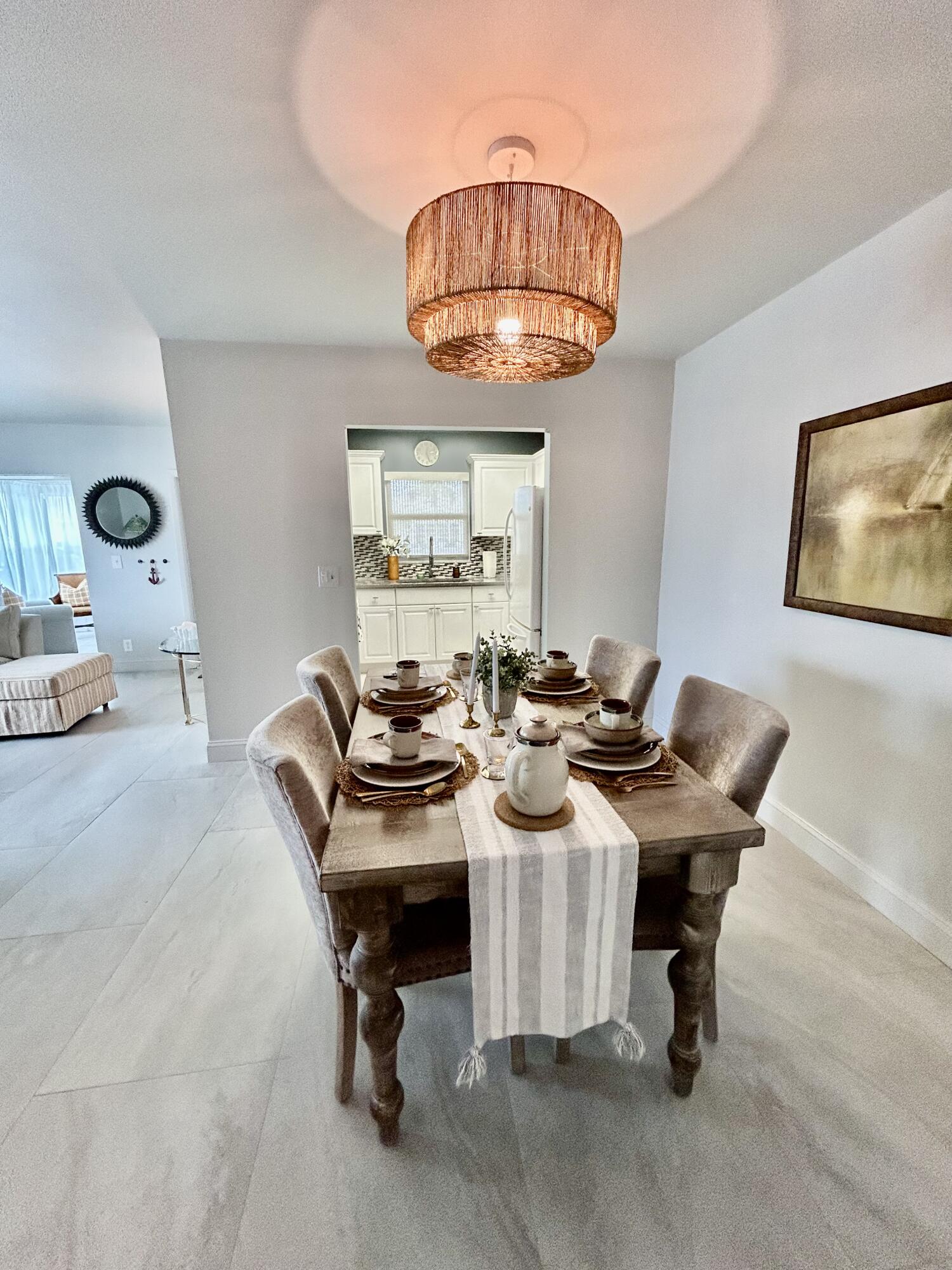 5289 Lake Front Boulevard, Unit D Delray Beach, FL 33484 - Photo 5 of 14 a view of a dining room with furniture